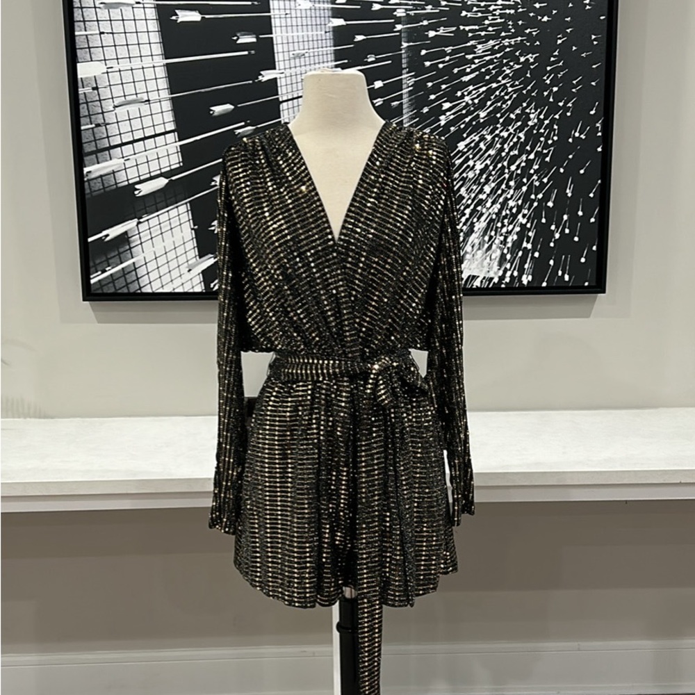 BRAND NEW!

Romper, Disco-Inspired, Open-Hole Back, Plunging Neck Line W/Tiebelt